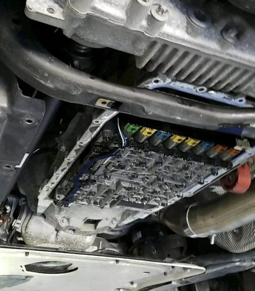 Close-up of ZF 8HP55/70/90 mechatronics unit during rebuild and valve body testing at LaCorte Tuning